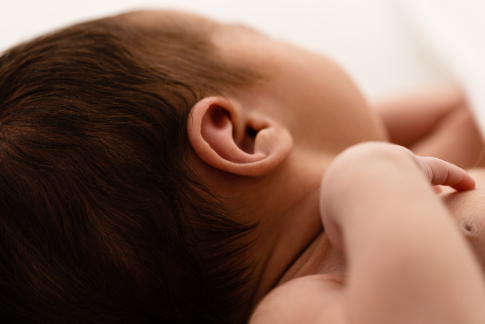 Close up image of newborn baby's ear during photoshoot in Melbourne photography studio
