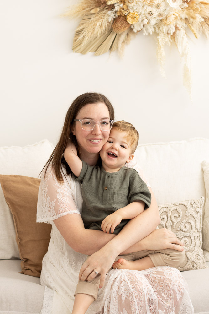Mother and son having fun during motherhood photography shoot